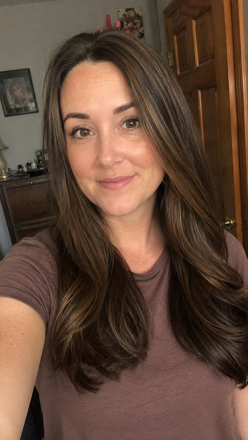 Natural front selfie showing smoother shinier hair after using hair mask